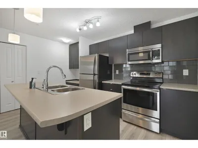 #114 3357 16A AV NW photo 9